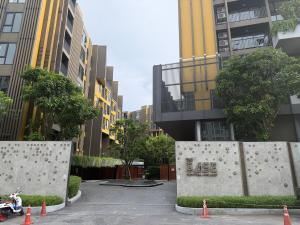 a parking lot in a city with tall buildings at Modern Condo-Pool&Gym-ROW in Ban Rangeng