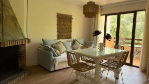 a living room with a couch and a table at Finca El Carrascal Arroyo frío, Sierra de Cazorla in Arroyo Frio