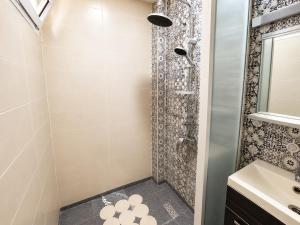 a bathroom with a shower and a sink at House Soleil in Agadir nʼ Aït Sa
