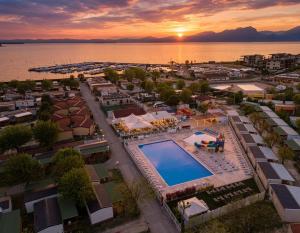 an aerial view of a resort with a swimming pool at Camping Village Butterfly in Peschiera del Garda