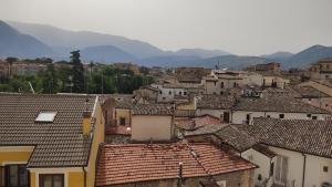 a group of buildings with mountains in the background at La Perla di Sulmona in Sulmona