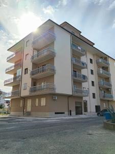 a building with balconies on the side of it at Casa Torrenova in Cirò Marina