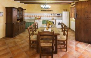 a kitchen with a table and chairs in a kitchen at Matasiete in Laroya