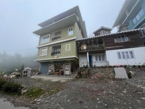 a house on the side of a hill with at Home away homestay in Namchi