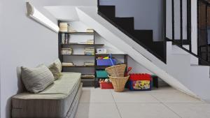 a living room with a couch and a staircase at Konrad 8 in Uvongo Beach +38 photos