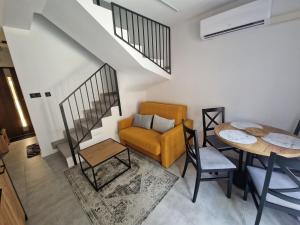 a living room with a couch and a table at Apartament Konecka 2J in Sielpia Wielka