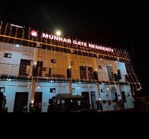 a muharram gate hospital lit up at night at Munnar Gate Residency in Pooppara