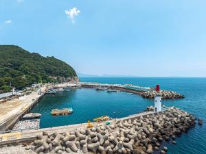 a view of a harbor with boats in the water at Namhae Padosori Oceanview Pension in Namhae
