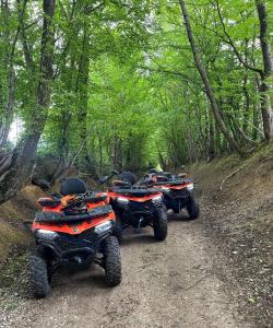 a group of four atvs parked on a dirt road at Apartman Bugojno in Bugojno