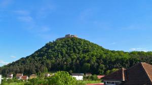 a hill with a house on top of it at Casa de oaspeti Minerva in Deva