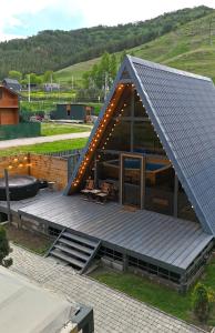 a building with a roof with lights on it at Scandinavia A-Frame in Akhundov