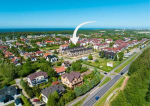 an aerial view of a city with a gateway arch at Baltic Season Spa Apartments in Grzybowo +106 photos