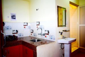 a small kitchen with a sink and a sink at Kattel Homestay and Apartments in Bālāju +24 photos