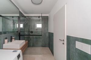 a bathroom with a sink and a shower at Mountain View Suites in Tesimo +22 photos