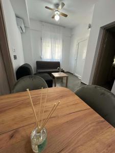 a wooden table with wooden sticks in a living room at Sunset Apartment A-4 in Perea