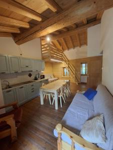 a living room with a couch and a table at ALBERGO DIFFUSO ORNICA NEL CUORE in Ornica