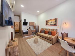 a living room with a couch and a table at Monção Golden I in Monção