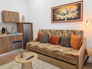 a living room with a couch and a table at Monção Golden I in Monção