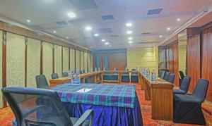 a conference room with a table and chairs in it at Dee Empresa Hotel in Kolkata