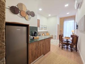 a kitchen with a counter and a dining room at Monção Golden I I in Monção
