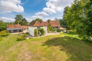 an aerial view of a house with a yard at The Cottage at Cobbolds Mill in Monks Eleigh