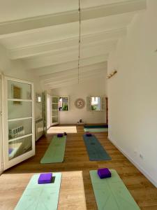 a yoga room with a row of yoga mats at Villa in Nature with Yoga Room, Peace and Tranquility in Puigpunyent