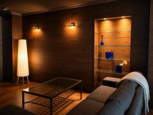 a living room with a couch and a glass table at Downtown Velvet Loft in Brussels +2 photos