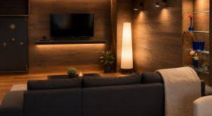 a living room with a couch and a flat screen tv at Downtown Velvet Loft in Brussels
