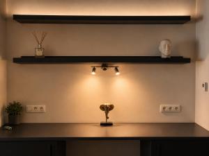 a room with a counter with lights on the wall at Downtown Velvet Loft in Brussels