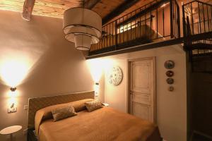 a bedroom with a bed in a room with a staircase at Colosseo Garden Lodge in Rome