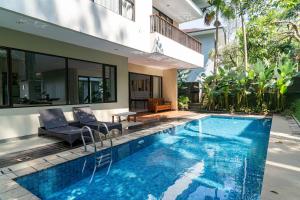 a swimming pool in the backyard of a house at Oyama City View Villa 4 Bedrooms With a Private Heated Swimming Pool and a Billiard Table in Bandung