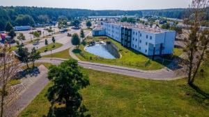 an aerial view of a building and a park at City Best Autobahnhotel Stolper Heide in Berlin