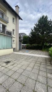 an empty parking lot in front of a building at Blue Sun in Ljubljana