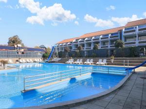 a large swimming pool in front of a building at Faaborg Holiday Center in Faaborg