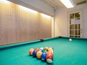 a pool table with a bunch of balls on it at Faaborg Holiday Center in Faaborg +79 photos