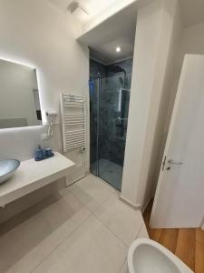 a bathroom with a shower and a toilet and a sink at B&B Magnolie in Palermo +50 photos
