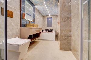 a bathroom with a toilet and a shower at Hotel Premium Suites-Free Airport Pickup in New Delhi +29 photos