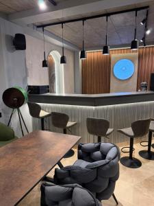 a bar with chairs and a table and a counter at Complex Turistic Perla Venusului in Venus