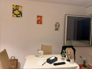 a table with a white table cloth on it at City Center big Appartement in St. Gallen