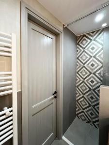 a walk in closet with a white door at Patossa in Chios +74 photos