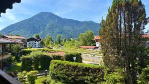 a view of a village with a mountain in the background at FeWo Rottachglück in Tegernsee