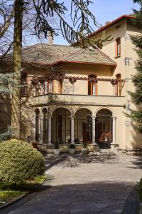 a large house with a driveway in front of it at Villa Jolanda, a Garamonds Property in Brunate