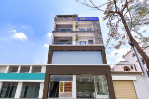 a building with a sign on top of it at FabHotel Metro Residency, Indore Junction Railway Station in Indore