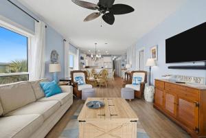 a living room with a couch and a table at Riviera Dunes 203 in Perdido Key