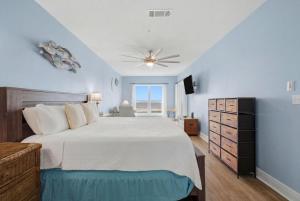 a bedroom with a bed and a ceiling fan at Riviera Dunes 203 in Perdido Key +55 photos