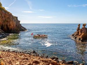 a group of people in a boat in the ocean at The Apple Garden in Allinge +44 photos