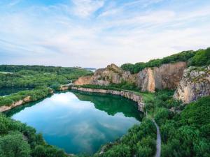 a river in the middle of a canyon at The Apple Garden in Allinge