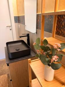 a kitchen with a counter with a black stove at Casa Van Gogh Catania in Catania