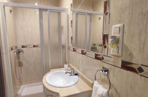 a bathroom with a sink and a shower at El Faro-Beach in Cullera
