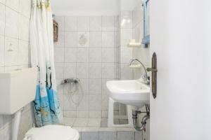 a bathroom with a toilet and a sink at Agnadi Studio in Serifos Chora